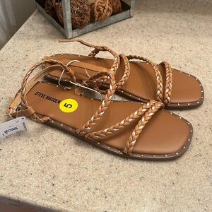 Steve Madden brand size 5 buckle closure flat sandals. NWT